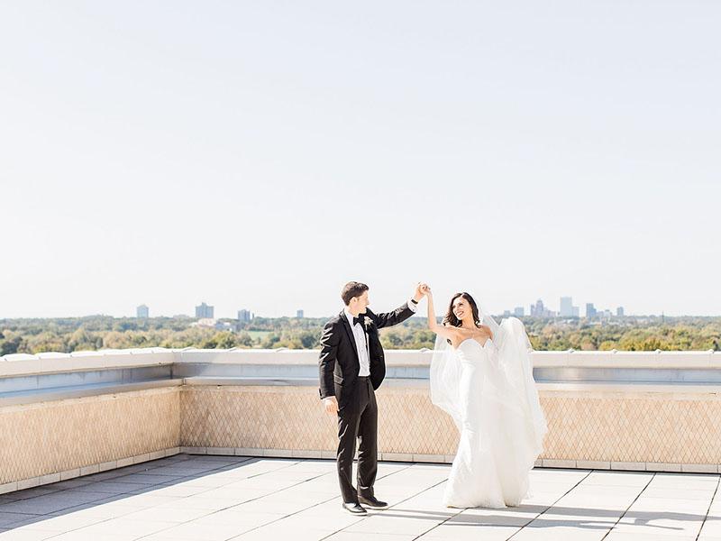bride and groom on rooftop